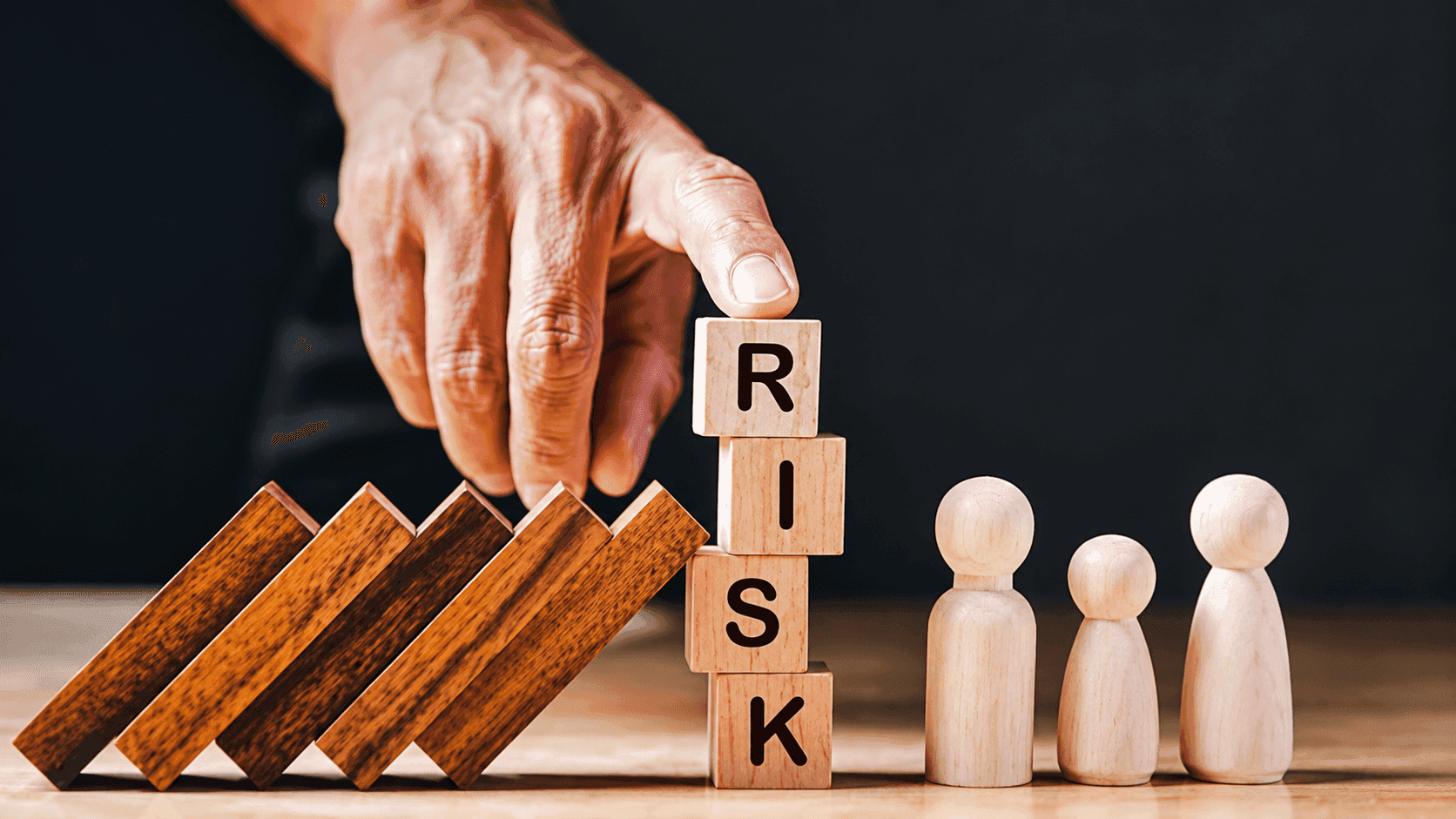 Dominoes protecting a family from risk